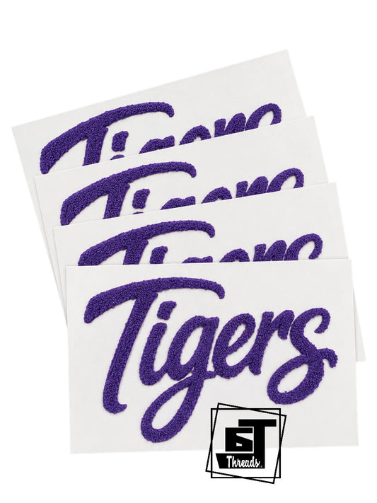 Four 'Tigers' stickers with a purple script on white paper, featuring the 'ST Threads' logo.