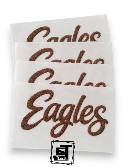 fuzzy brown eagles cursive word patch on a white background