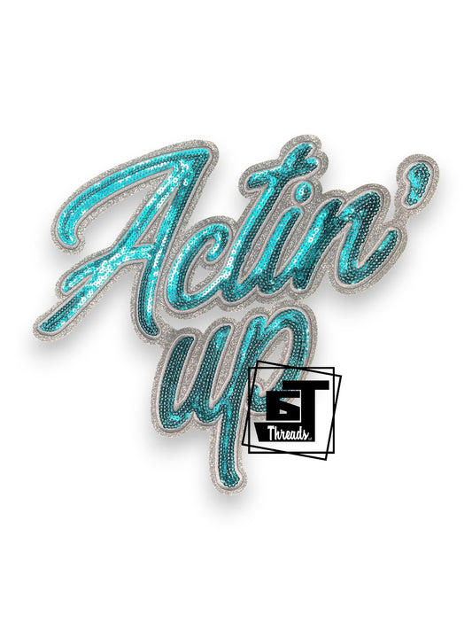 Measurements: 6.5 inches wide by 9 inches tall
Teal Actin' Up Western Sequin Patch with white embroidery and white gitter background
Iron-on patch