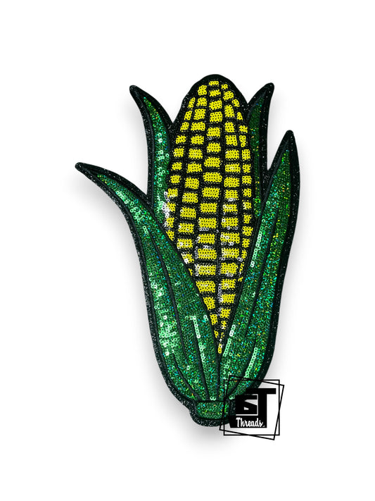 Measurements: 8 inches wide by 11.5 inches tall
Yellow and Green Sequin Corn with black embroidery and a black glitter backgropund
Iron-on patch
