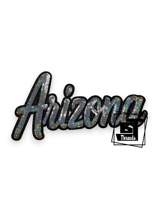 Measurements: 12 inches wide by 6.5 inches tall
Silver Cursive Sequin Arizona with black embroidery and black glitter background