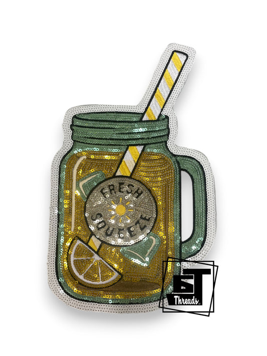 Measurements: 10.5 inches tall by 6 inches wide
Sequin yellow Fesh Squeeze lemonade patch with black embroidery and white sequin background
Iron-on Patch