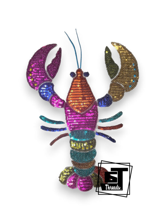 Measurements 10 inches tall by 8 inches wide
Sequin Multi-colored lobster with blue embroidery details.&nbsp;
Iron-on Patch
