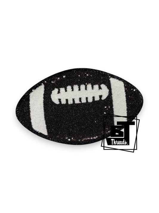 Measurements 10 inches wide by 6 inches tall
Sequin Brown football with white chenille with black glitter background
Iron-on patch