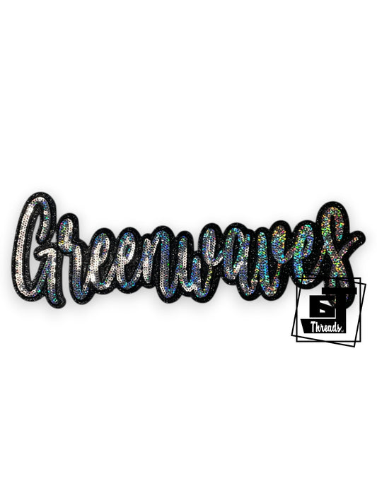 Measurements: 11.5 inches wide by 4 inches tall
Silver cursive sequin Greenwaves patch with black embroidery and a black glitter background
Iron-on Patch