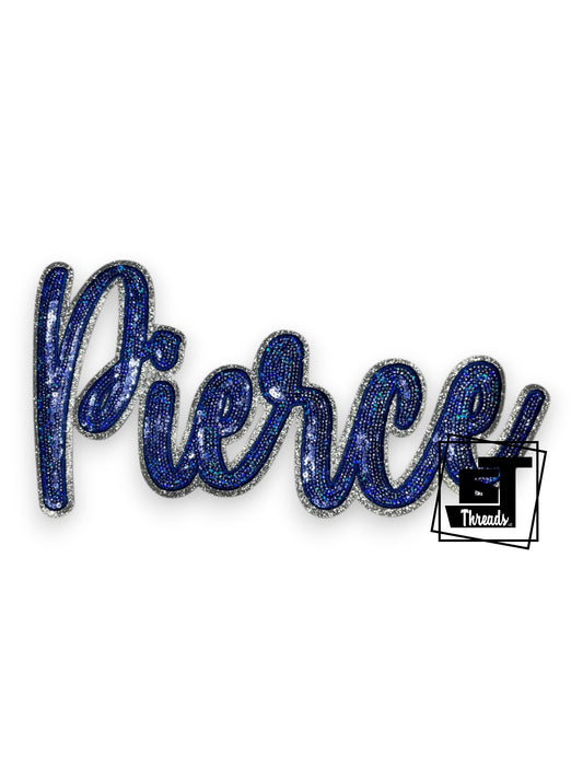 Measurements: 11.5 inches wide and 6 inches tall
Blue cursive sequin Pierce with blue embroidery and silver glitter background
Iron-on Patch