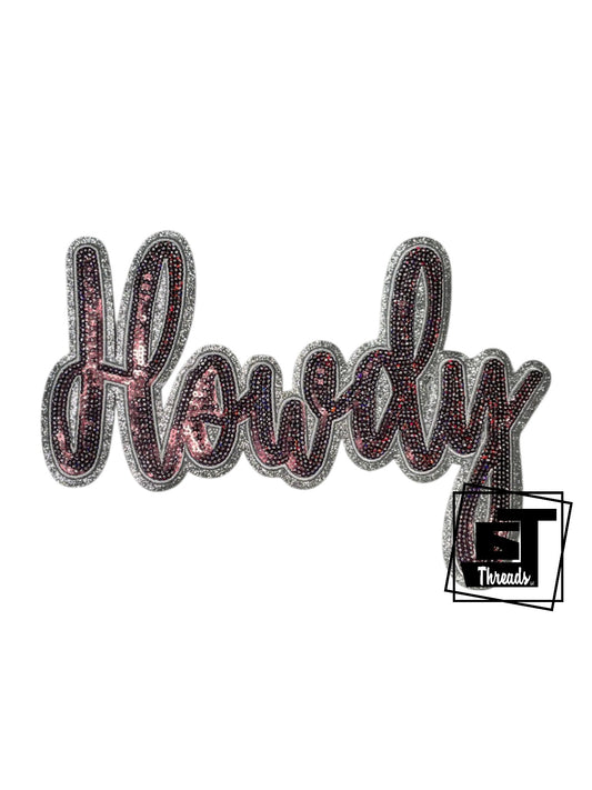 Measurements 9.5 inches wide by 7 inches tall
Maroon cursive sequin Howdy with silver embroidery and silver glitter background
Iron-on Patch