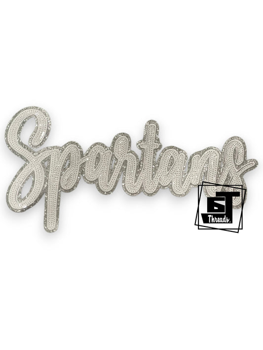 Silver 'Spartans' text patch on a white background with 6St Threads logo.