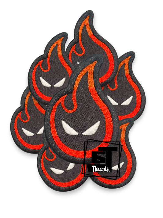 Flame-shaped patches with a logo in the corner on a white background