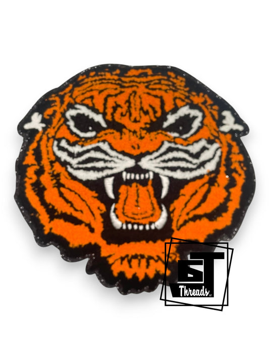 Orange tiger head design with black outline on a white background, featuring the 'ST Threads' logo.