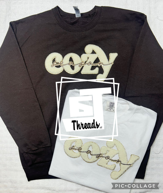 Chenille cozy season on a brown crewneck