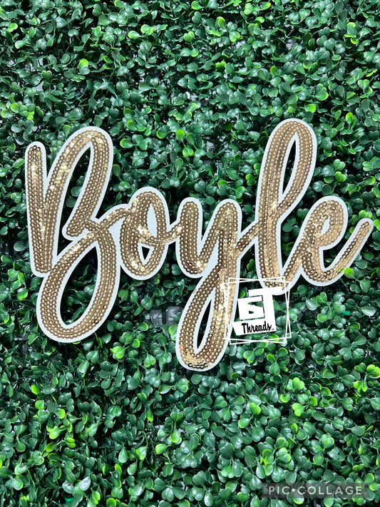 Gold cursive sequin Boyle iron on patch
