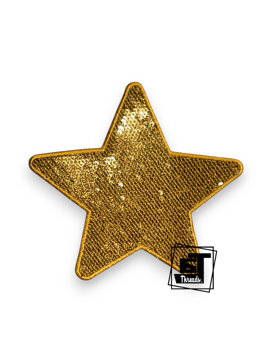A single five-pointed star patch covered in textured gold sequins with a gold embroidered border, shown on a plain white background with a small Threads logo watermark in the lower right corner.