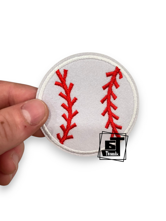 A hand holding a round embroidered baseball patch with red stitching on a white background, featuring a '5 Threads' logo overlay.