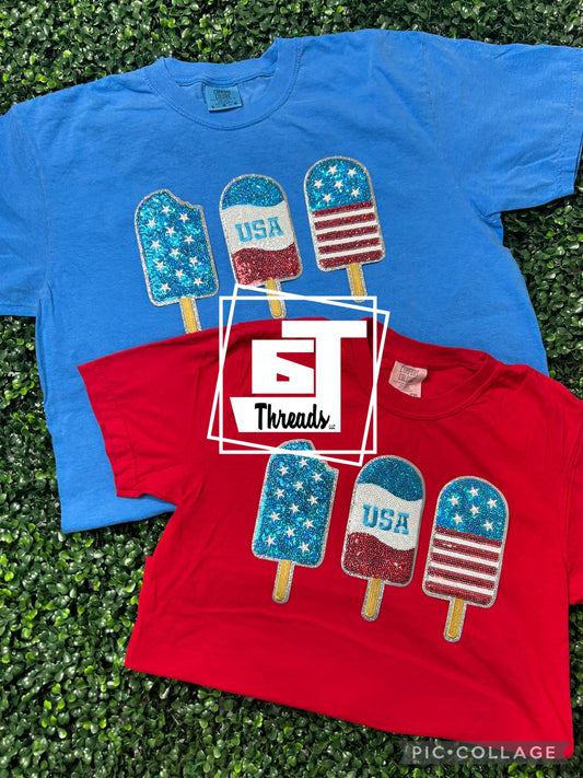 Three Pop Sicels on royal blue and red shirt