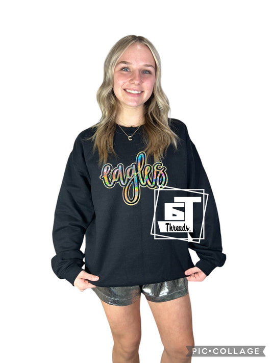 gold cursive metallic eagles patch on black sweatshirt