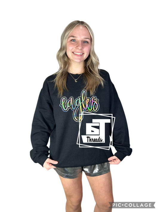 Silver metallic cursive eagle on a black sweatshirt