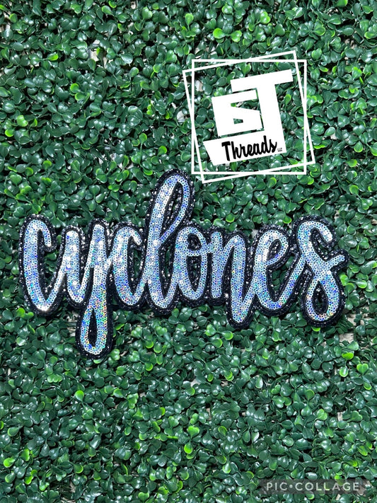 Cursive, cyclones, silver sequins with black glitter back