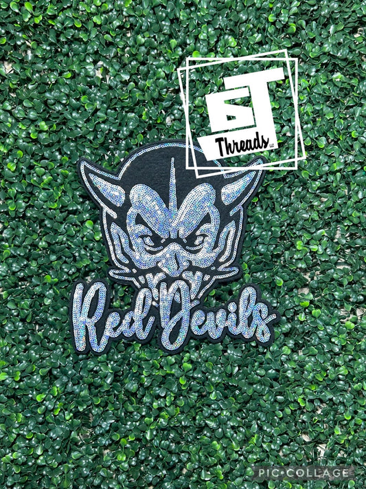 Silver sequins with black felt background with red devils head