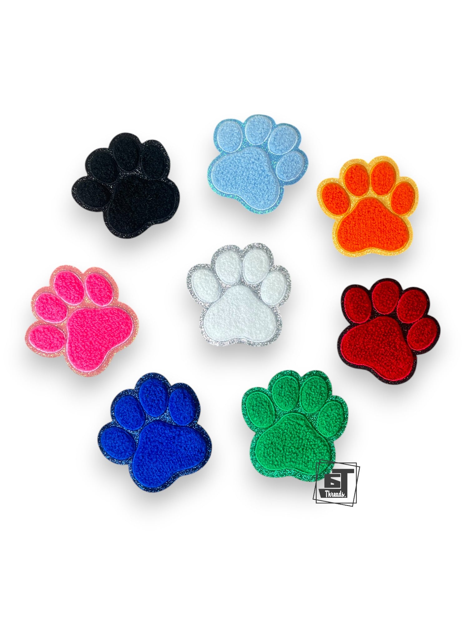 Set of colorful paw-shaped objects on a white background