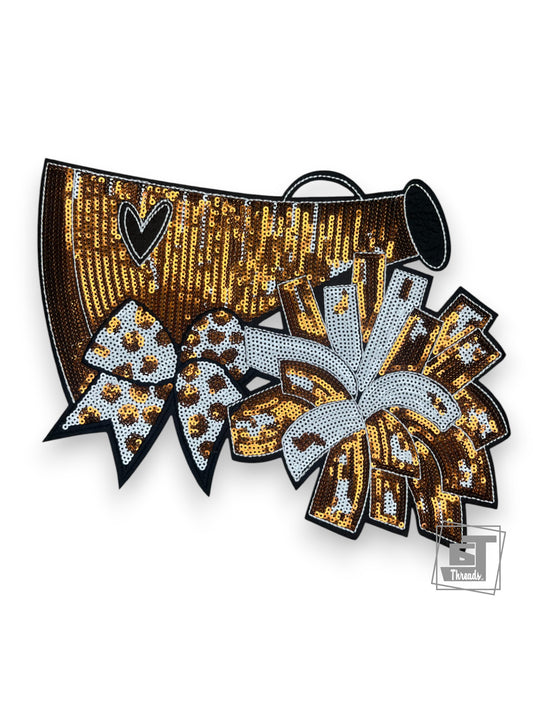 Sequined cheerleading outfit with leopard print bow and heart design on a white background