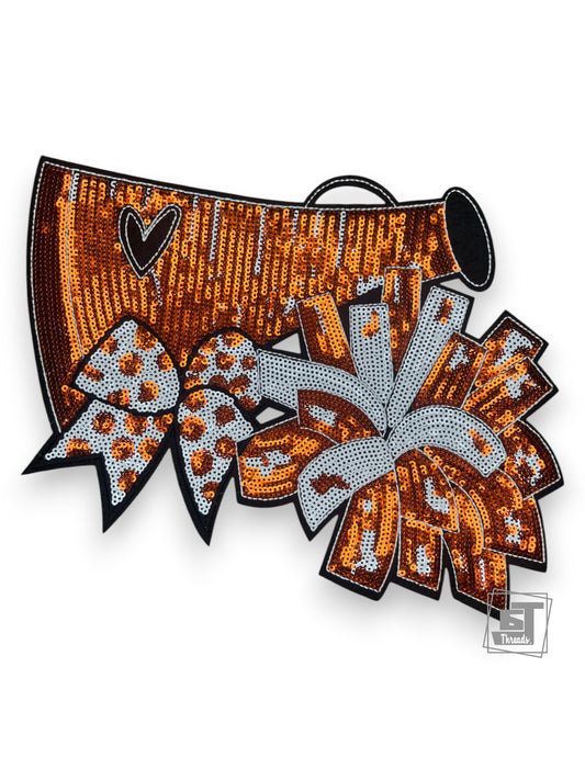 Decorative item with sequins and bows on a white background