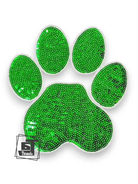 Green glittery paw print design on a white background