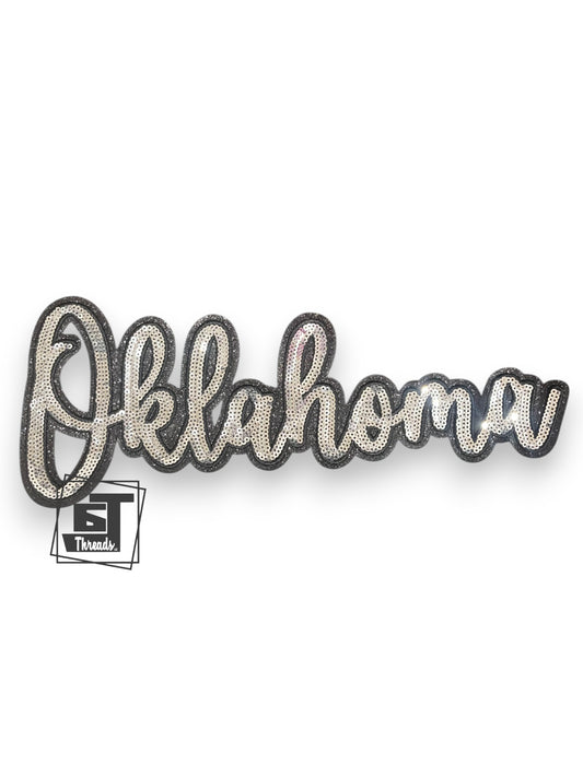 Decorative sign with 'Oklahoma' text on a white background