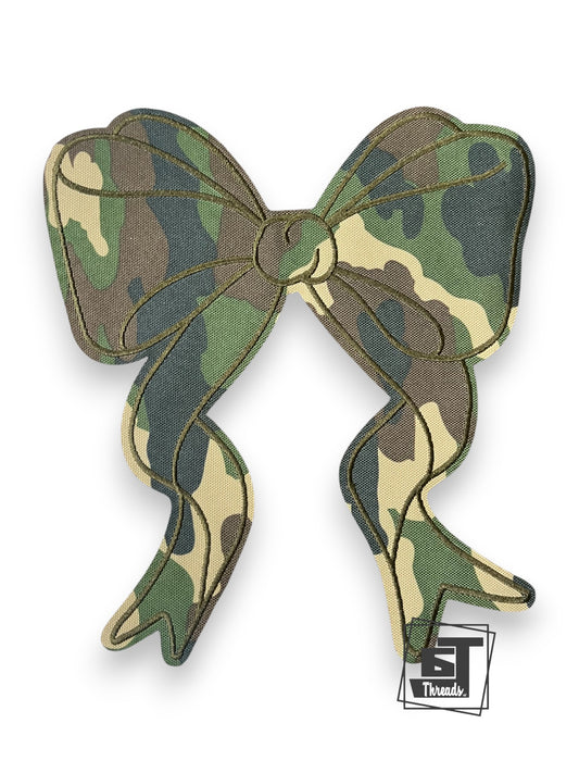 Camouflage bow-shaped object with a brand logo on a white background