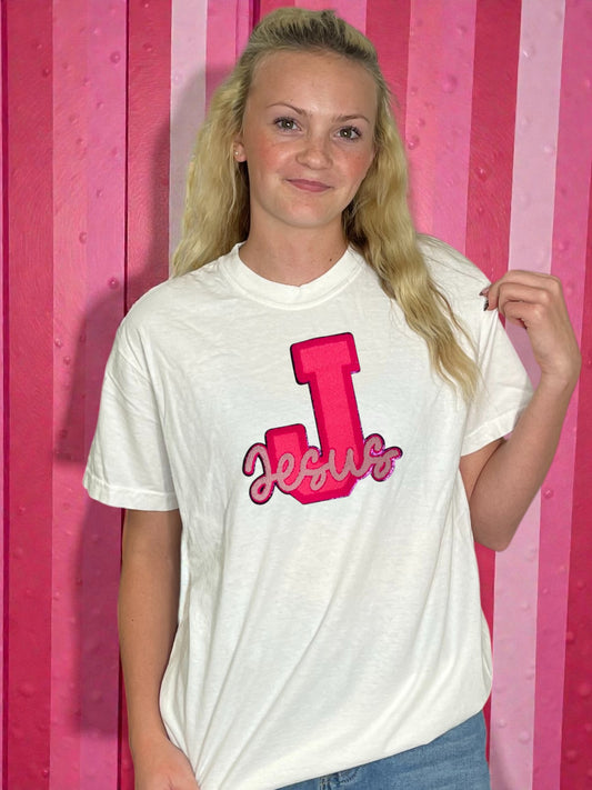 Pink jesus patch on a t-shirt