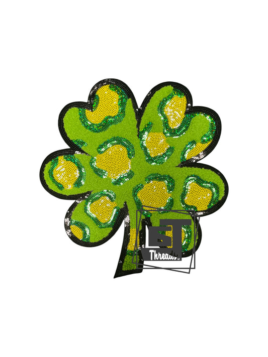 Measurements 10 inches wide by 10 inches tall
Chenille green and yellow leopard clover with sequin details and a black sequin background
Iron-on Patch