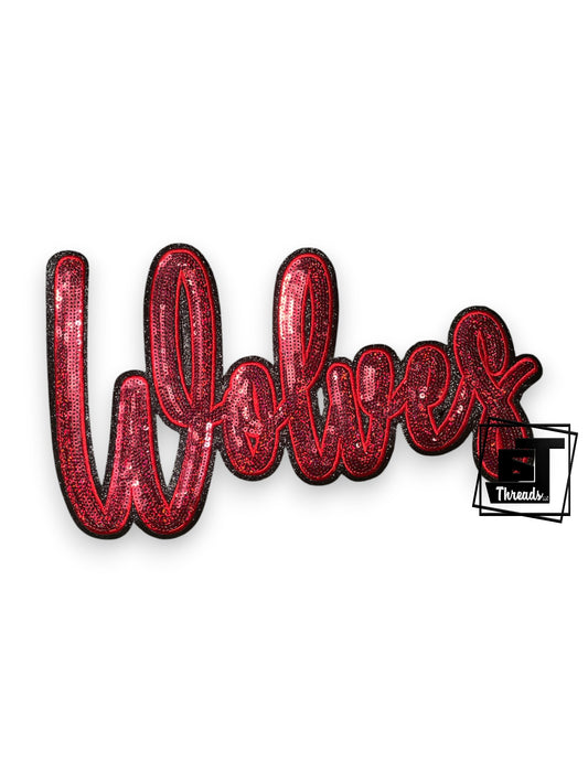 Red sequin patch with 'Wolves' text on a white background
