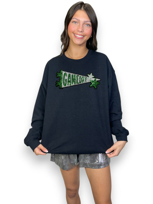 Woman wearing a navy sweatshirt with 'GAME DAY' text on a white background