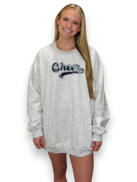 Women wearing grey sweatshirt with the wording "cheer"
