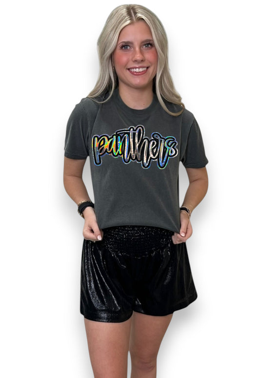 Woman wearing a black t-shirt with 'Panthers' printed on it and black shorts.