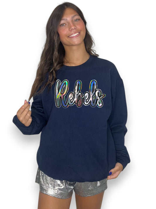 Woman wearing a navy sweatshirt with 'Rebels' in colorful letters on a white background