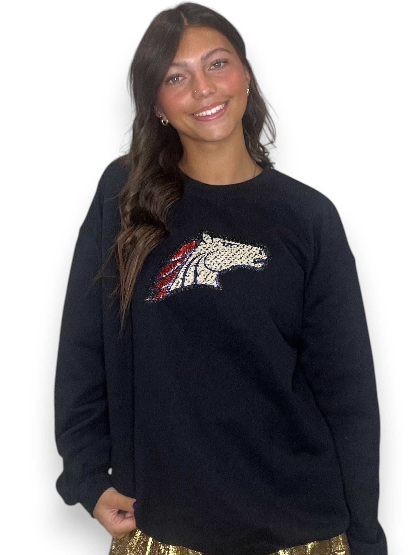 Woman wearing a black sweatshirt with a colorful logo on a white background