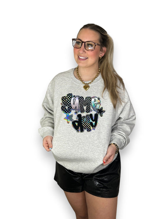 metallic checkered game day iron on patch on gray sweatshirt