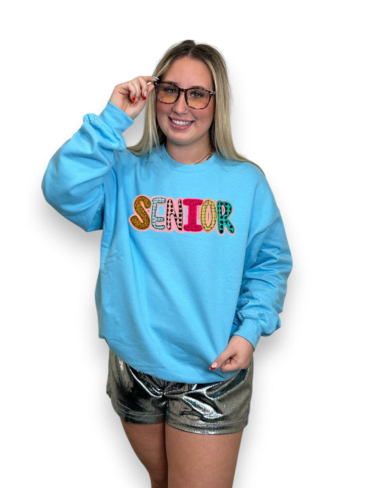 senior patch on blue sweatshirt