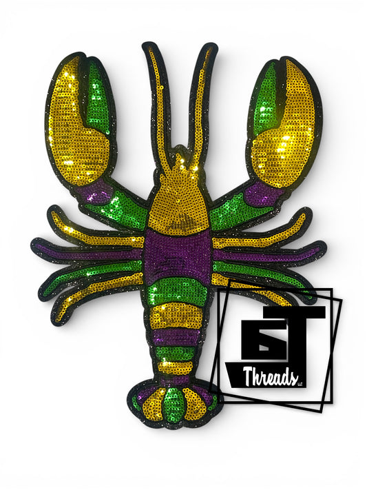 Colorful crawfish patch with Mardi Gras colors on a white background, featuring the brand 'BT Threads'.